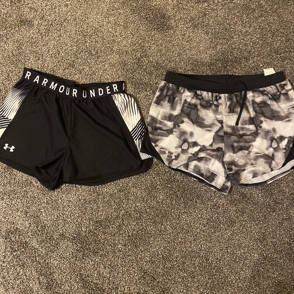 Two pair of ladies under armour shorts size medium